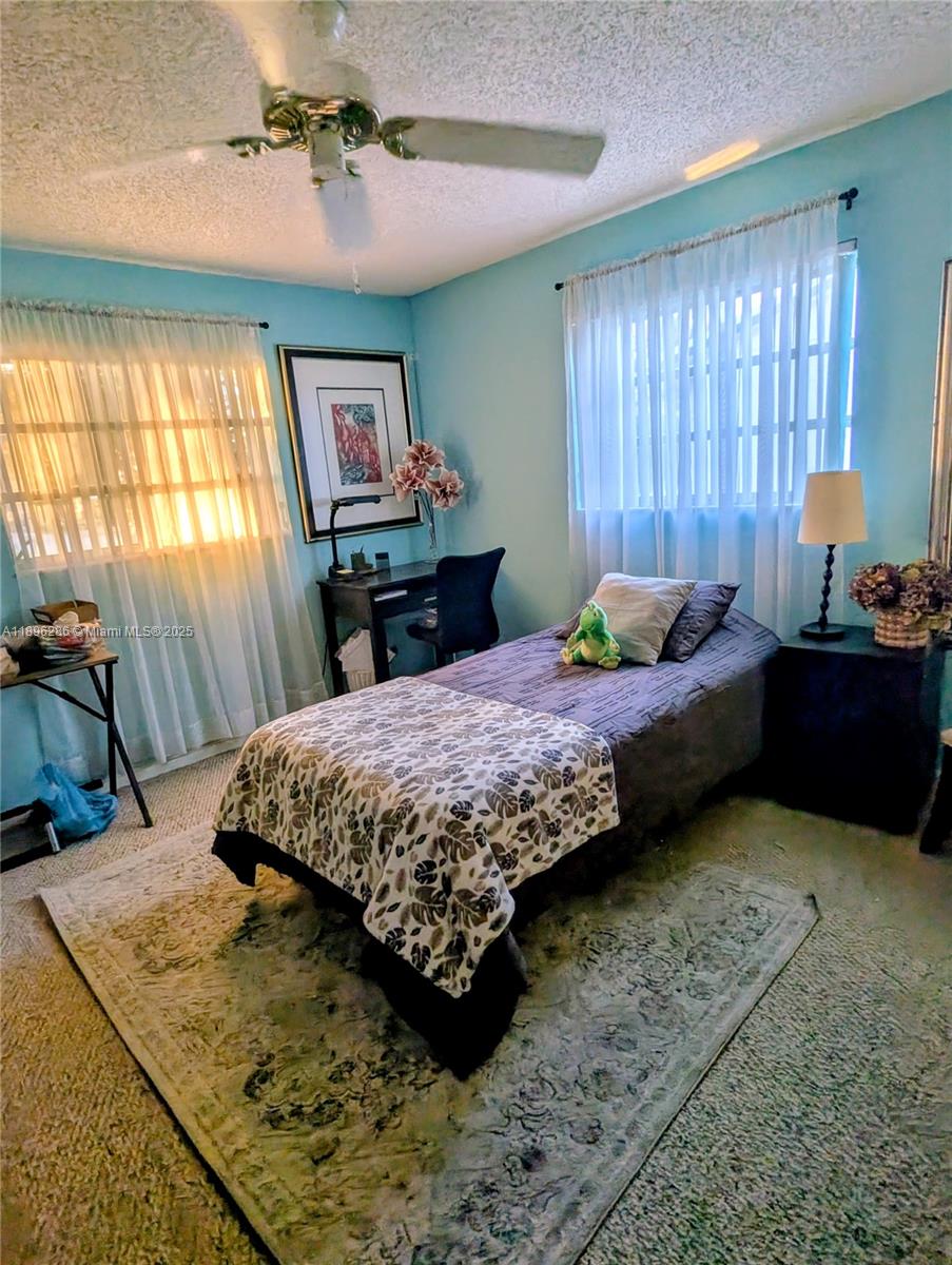 3031 Northwest 74th Avenue Hollywood, FL 33024 - Photo 31 of 34 a bedroom with a bed dresser and window