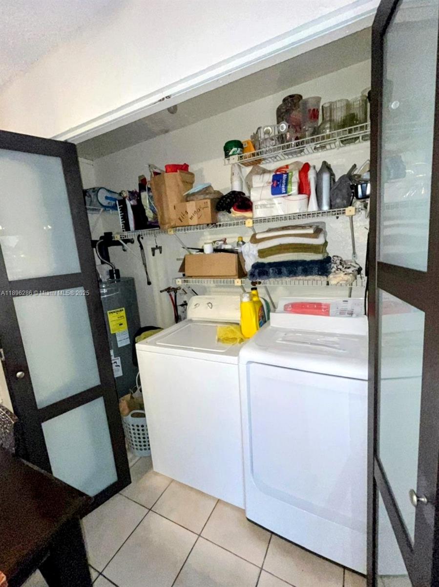 3031 Northwest 74th Avenue Hollywood, FL 33024 - Photo 34 of 34 a utility room with dryer and washer