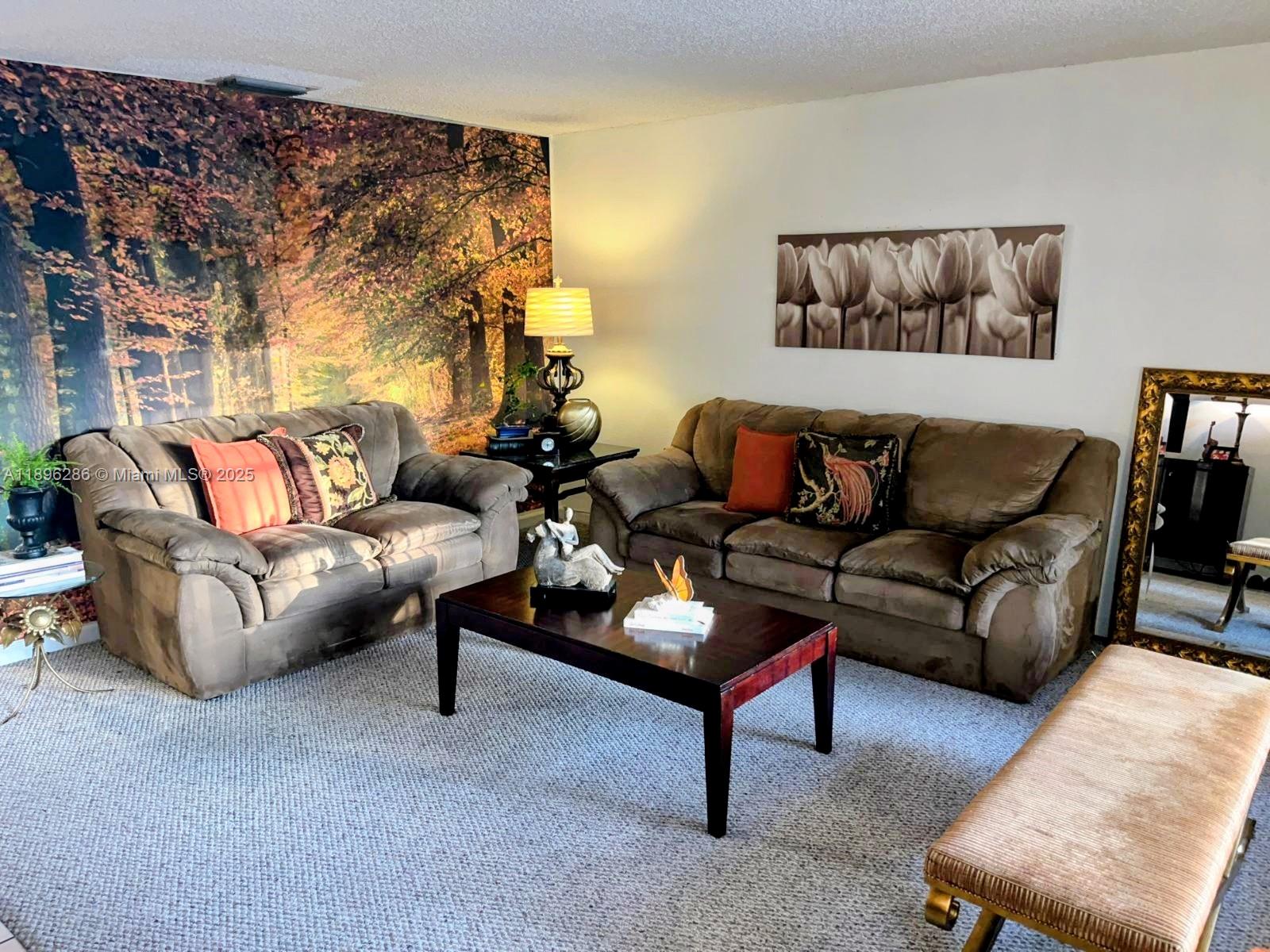 3031 Northwest 74th Avenue Hollywood, FL 33024 - Photo 4 of 34 a living room with furniture and a potted plant