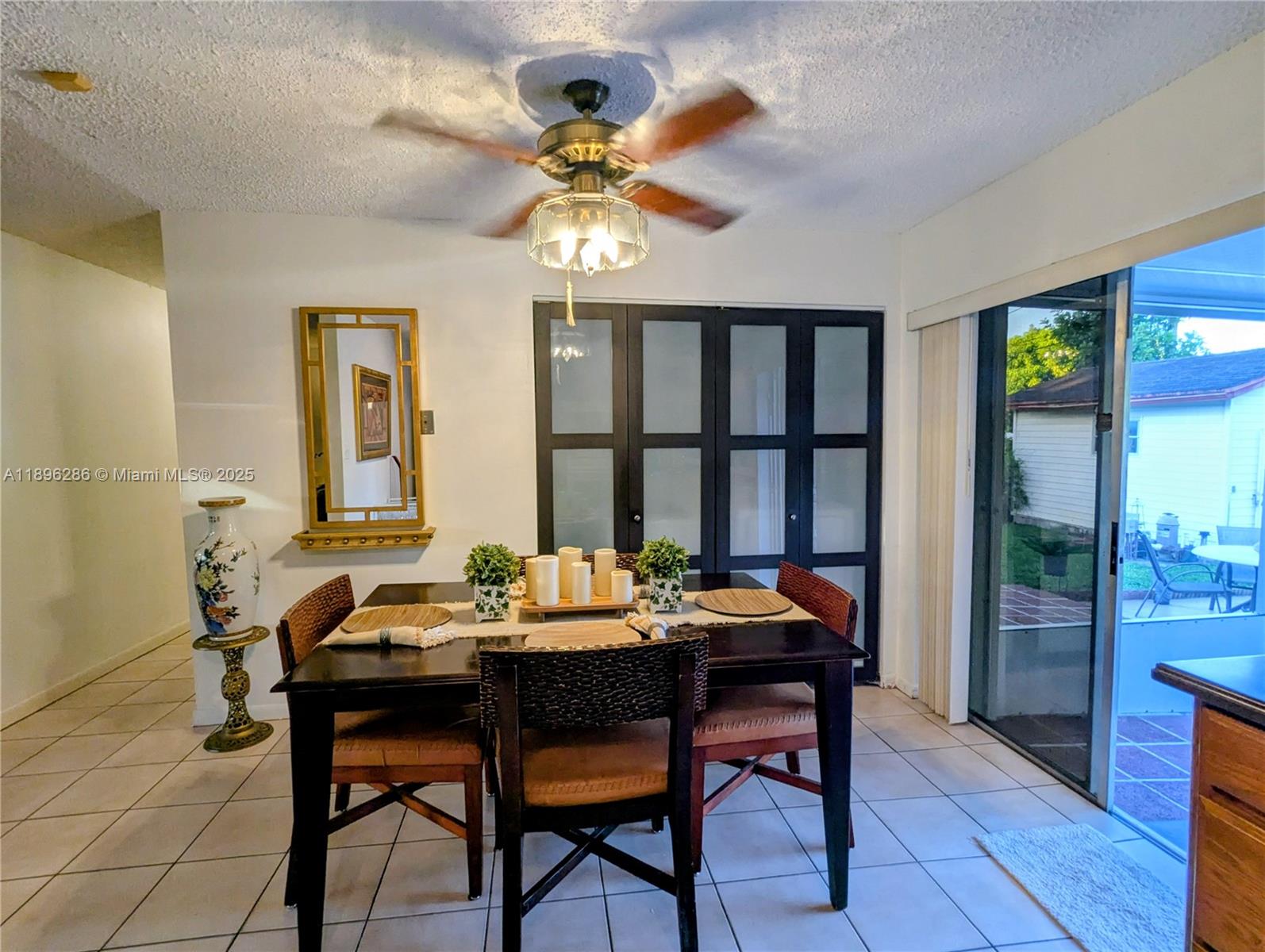 3031 Northwest 74th Avenue Hollywood, FL 33024 - Photo 7 of 34 a dining room with wooden floor and a chandelier