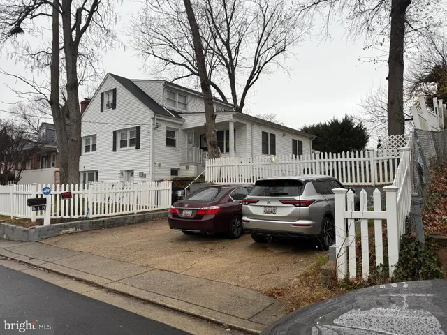 a car parked in front of a house