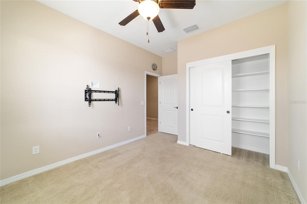 5670 Northwest 39th Lane Ocala, FL 34482 - Photo 37 of 61 a view of a room with a ceiling fan and refrigerator