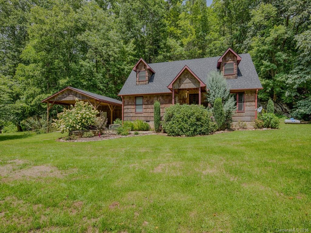 541 Chinquapin Road Canton, NC 28716 - Photo 1 of 23 a front view of a house with garden