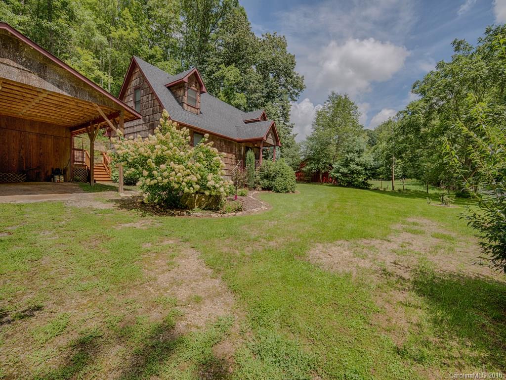 541 Chinquapin Road Canton, NC 28716 - Photo 2 of 23 a view of a garden with a house
