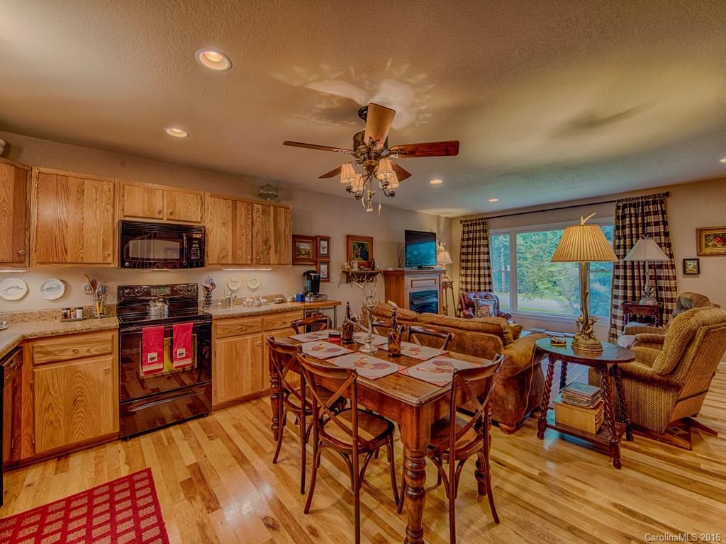 541 Chinquapin Road Canton, NC 28716 - Photo 11 of 23 a view of a dining room with furniture window and outside view