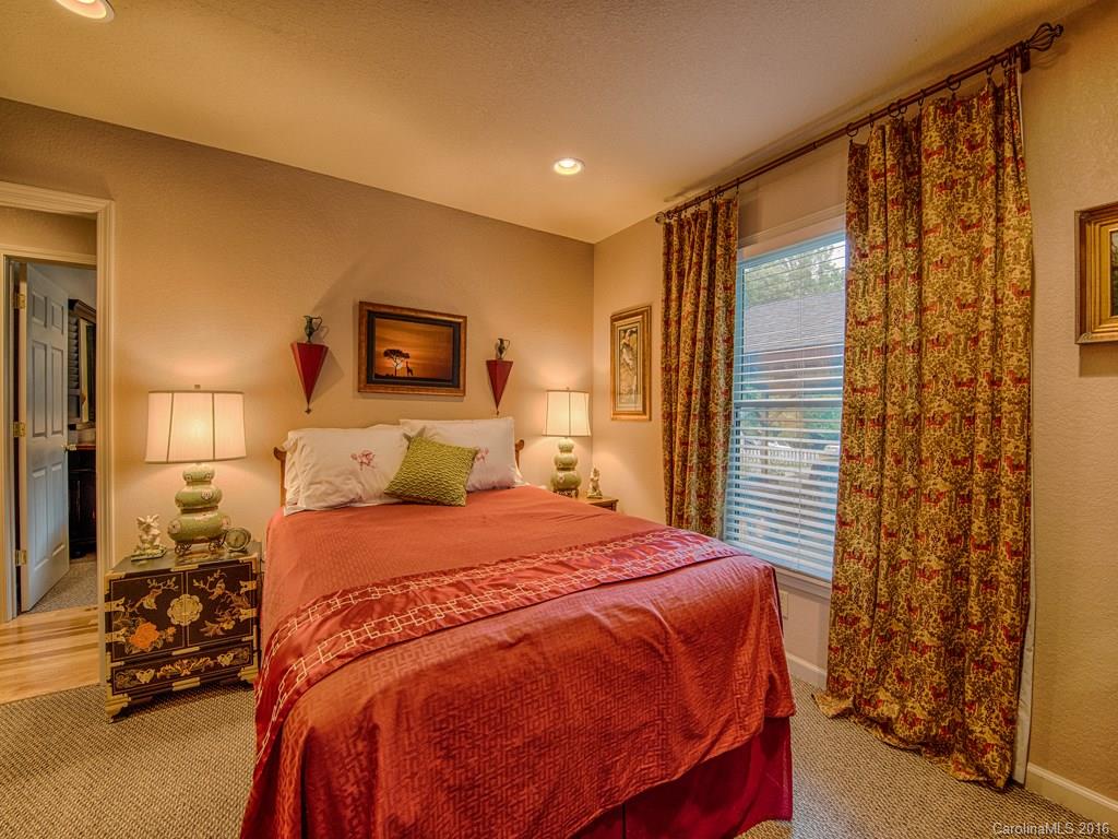 541 Chinquapin Road Canton, NC 28716 - Photo 13 of 23 a bedroom with a bed and a night stand