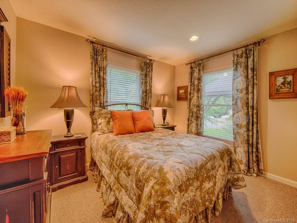 541 Chinquapin Road Canton, NC 28716 - Photo 15 of 23 a bedroom with a bed and a night stand