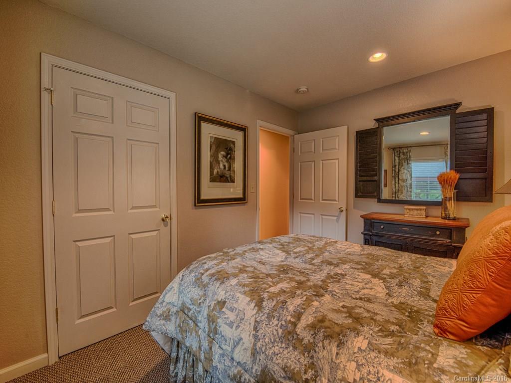 541 Chinquapin Road Canton, NC 28716 - Photo 16 of 23 a bedroom with a large bed and a dresser