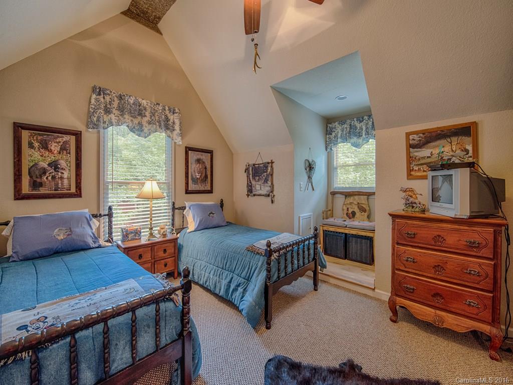 541 Chinquapin Road Canton, NC 28716 - Photo 22 of 23 a bedroom with furniture and a window