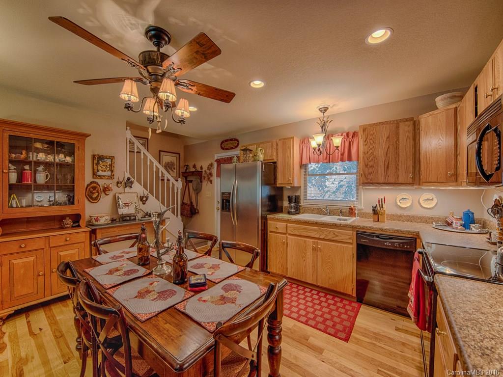 541 Chinquapin Road Canton, NC 28716 - Photo 10 of 23 a kitchen with a sink stove and cabinets
