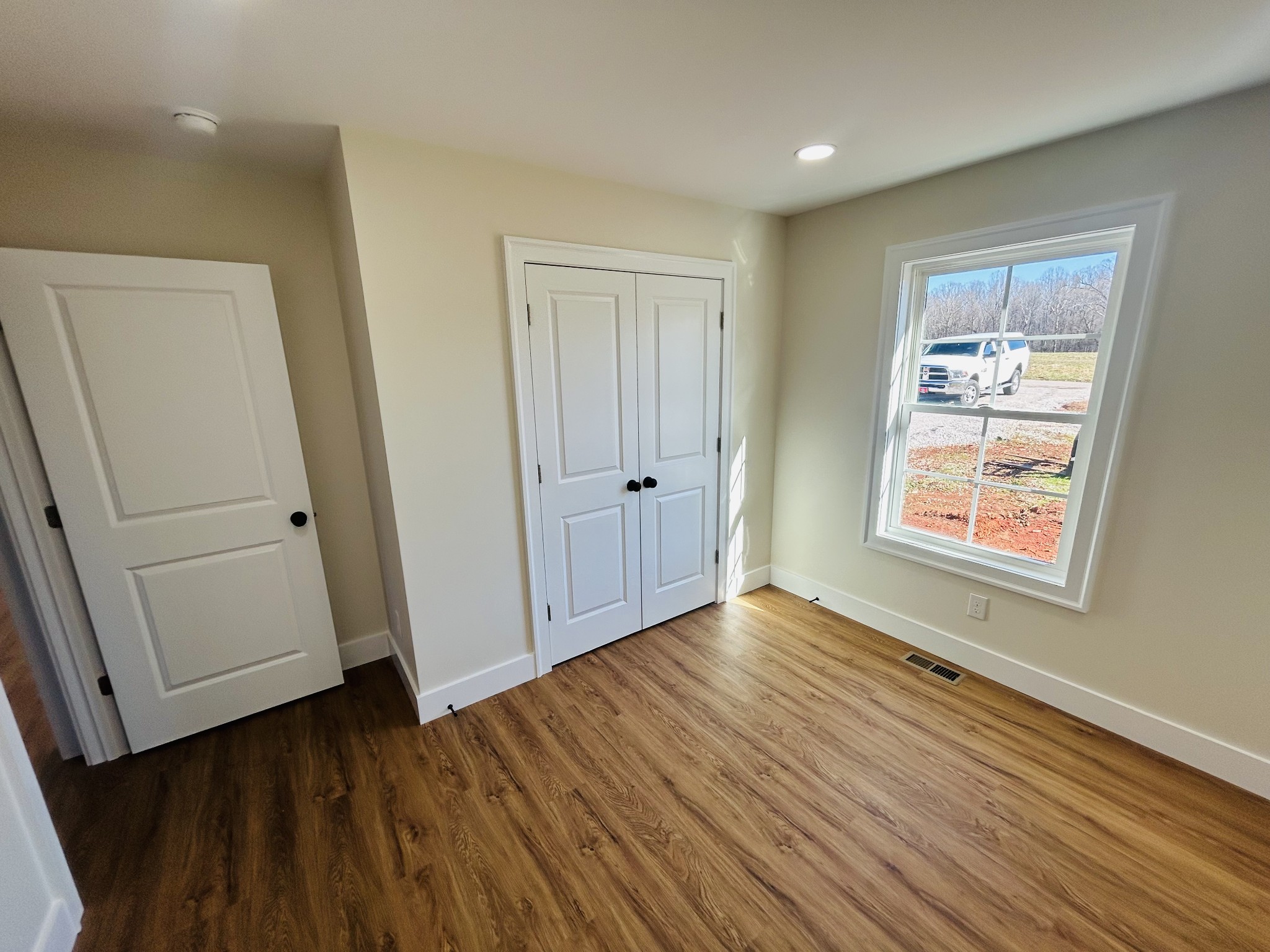 614 Haddon Lane Winchester, TN 37398 - Photo 10 of 12 wooden floor in an empty room with a window