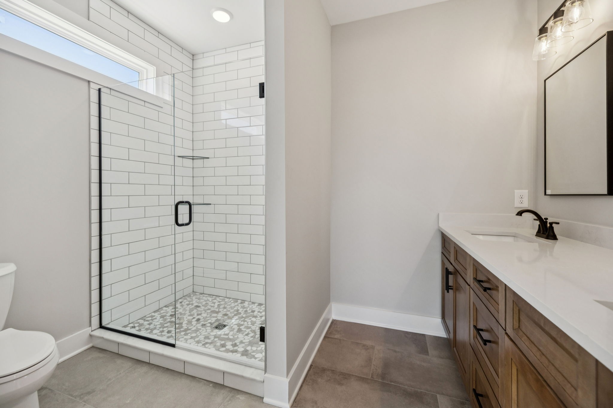 117 East Campbell Road, Unit A Madison, TN 37115 - Photo 21 of 29 a bathroom with a shower sink vanity and toilet