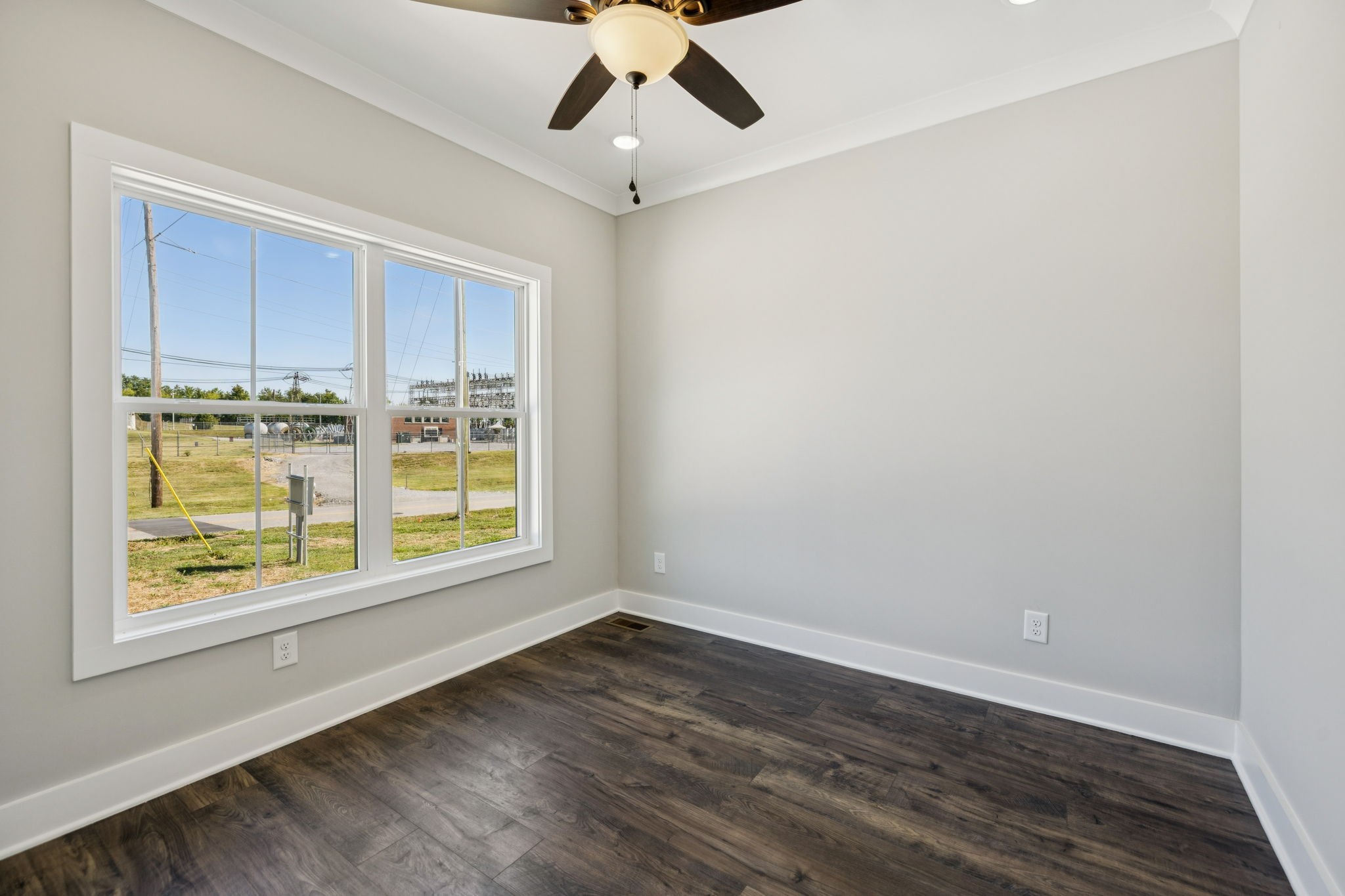 117 East Campbell Road, Unit A Madison, TN 37115 - Photo 6 of 29 a view of an empty room with a window and wooden floor