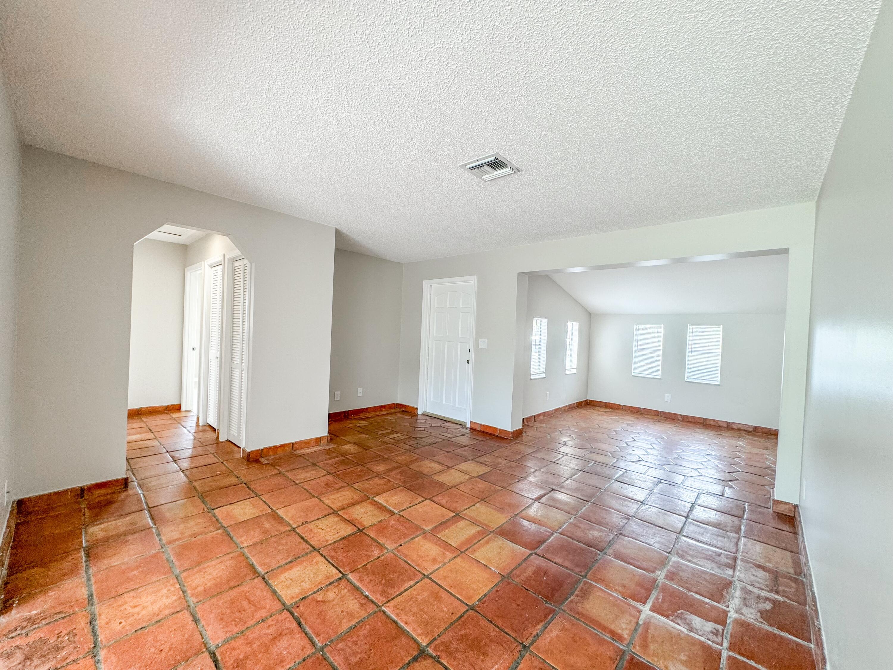 2735 Richard Road, Unit A West Palm Beach, FL 33403 - Photo 1 of 14 a view of an empty room and window