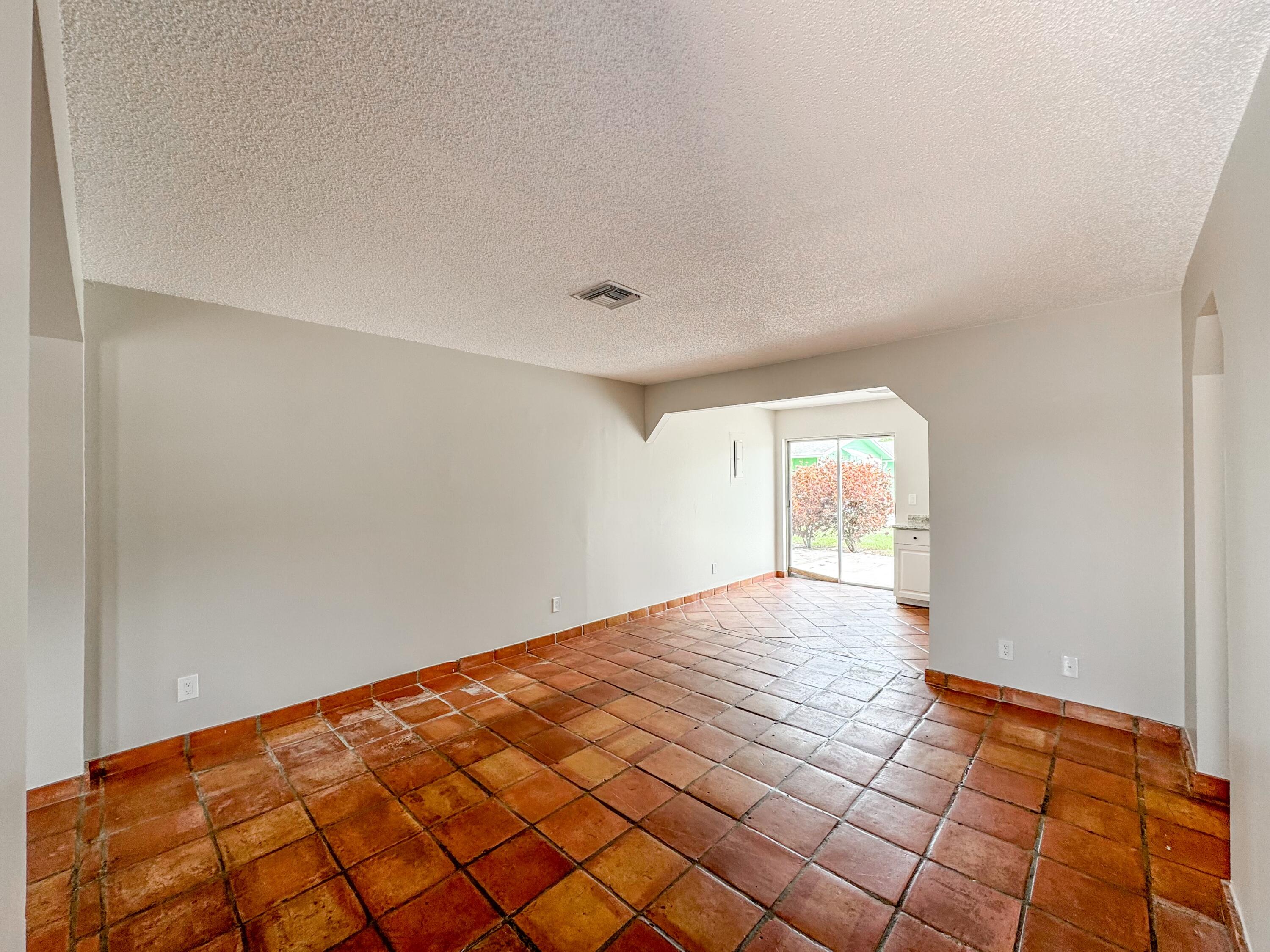 2735 Richard Road, Unit A West Palm Beach, FL 33403 - Photo 2 of 14 a view of an empty room and window