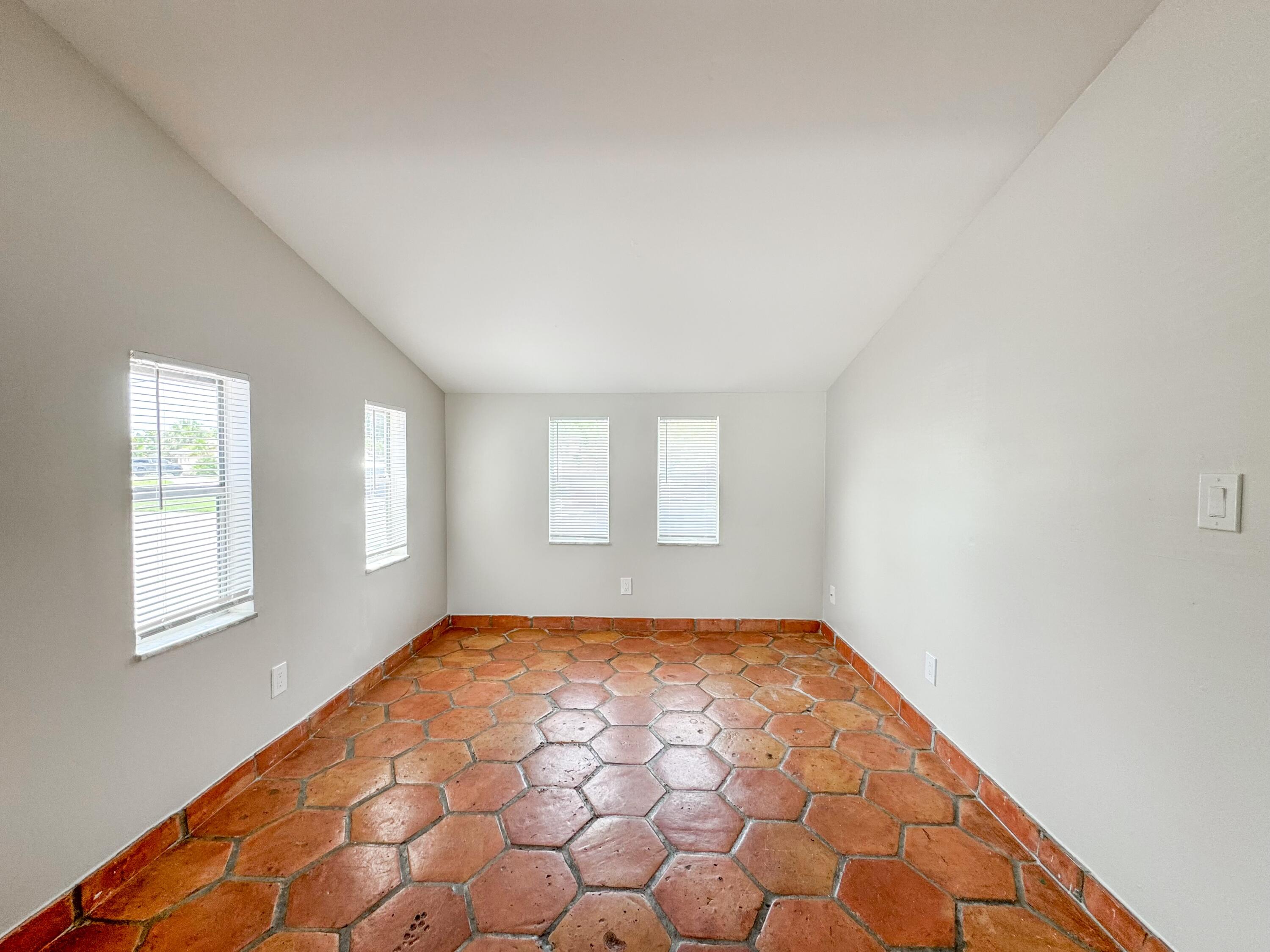 2735 Richard Road, Unit A West Palm Beach, FL 33403 - Photo 3 of 14 a view of empty room with windows