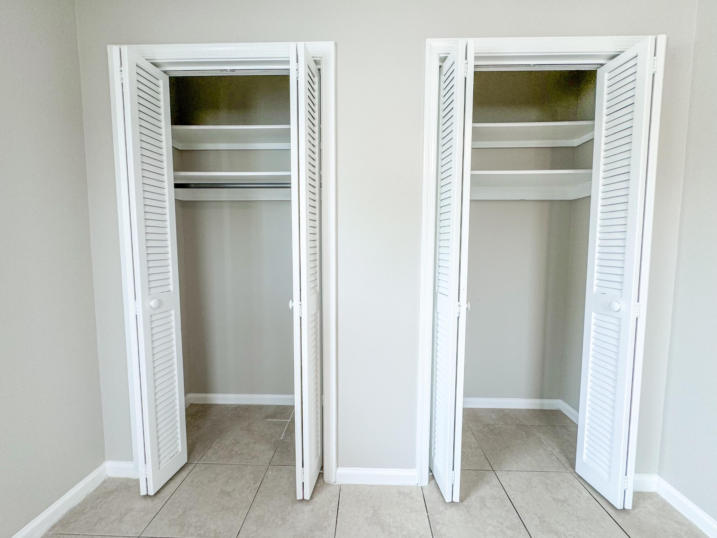 2735 Richard Road, Unit A West Palm Beach, FL 33403 - Photo 8 of 14 a view of walk in closet with cabinet