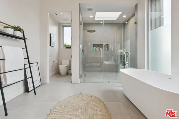 a bathroom with a shower and a toilet