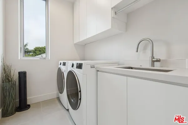 a view of a patio with couches table and chairs and potted plants