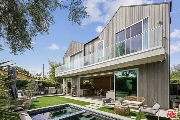 a view of a chair and table of the back yard