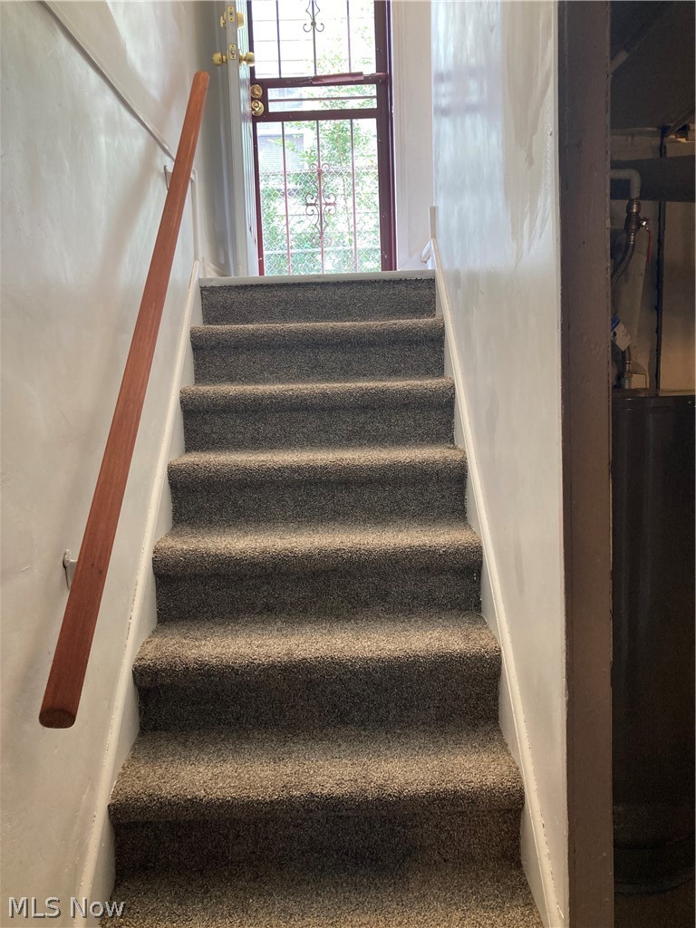 3800 Strandhill Road Cleveland, OH 44128 - Photo 25 of 34 Stairs with carpet to basement