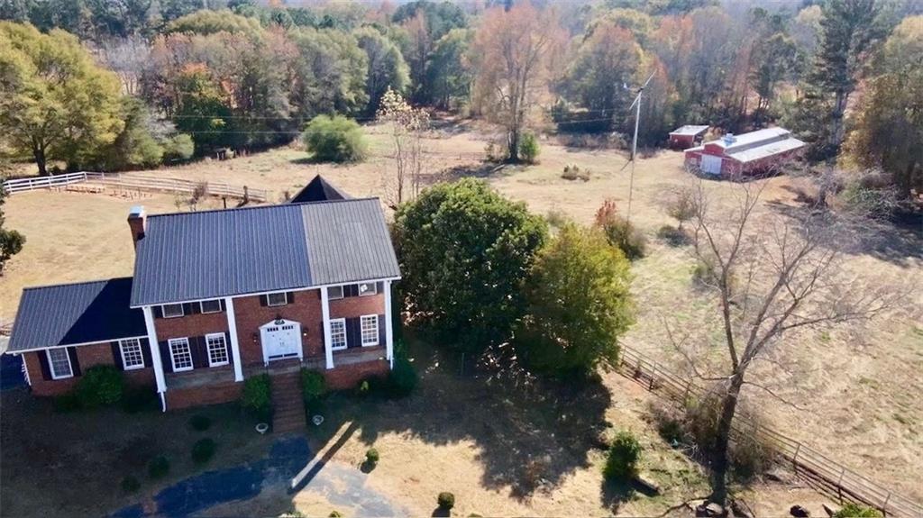 740 Patrick Mill Road Southwest Winder, GA 30680 - Photo 2 of 12 a view of house with yard and trees in the background