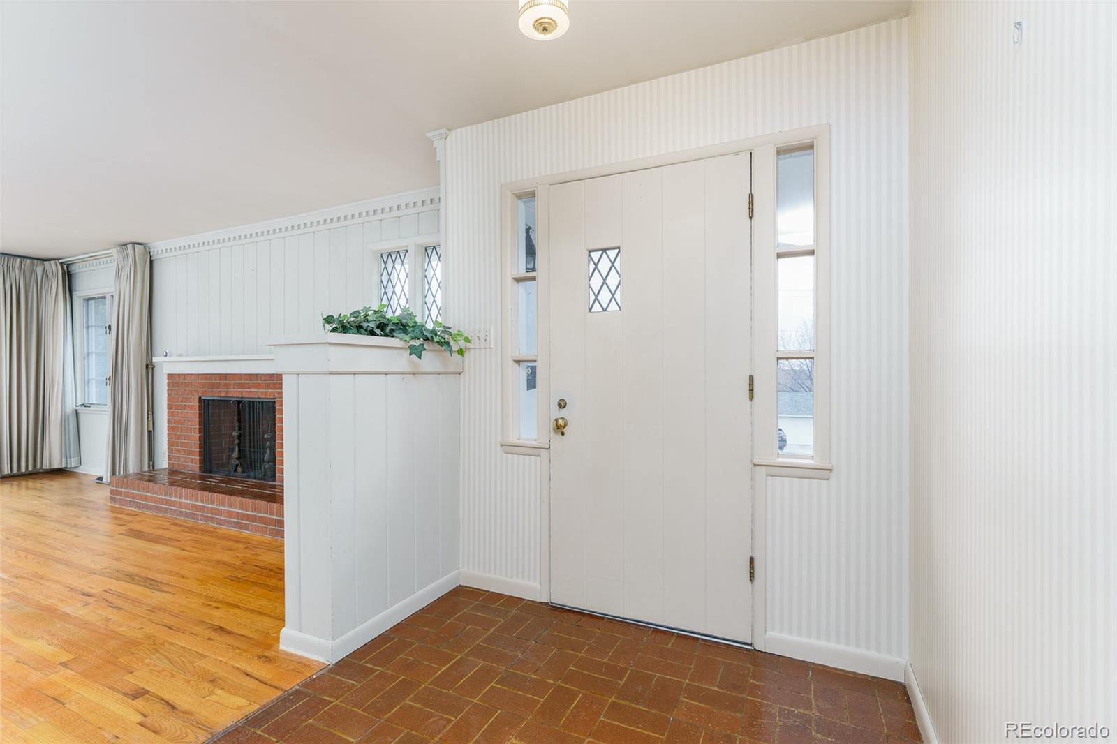 4184 Everett Drive Wheat Ridge, CO 80033 - Photo 5 of 22 a view of a livingroom with wooden floor