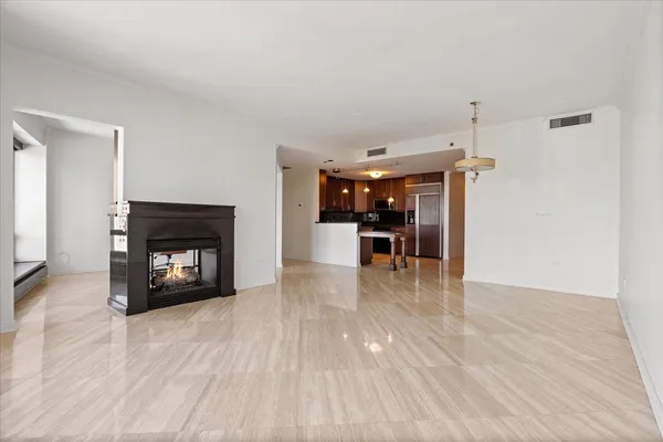 a view of a livingroom with furniture and a fireplace