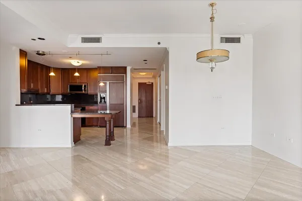 a view of a kitchen with a sink stainless steel appliances and cabinets