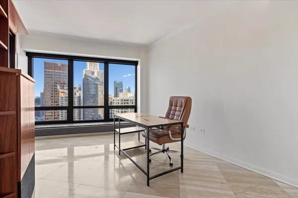 a view of a workspace with furniture