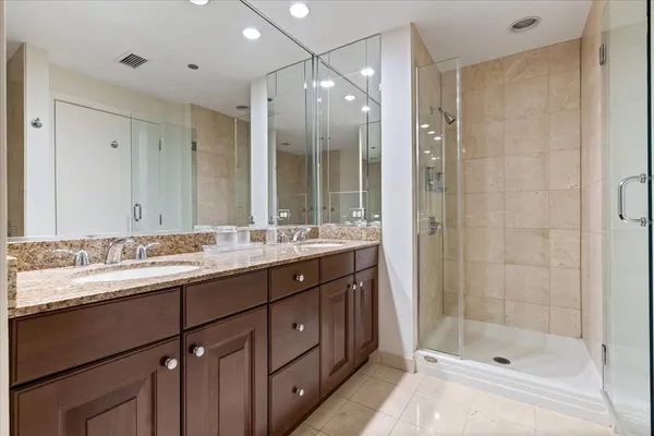 a bathroom with a tub and a shower