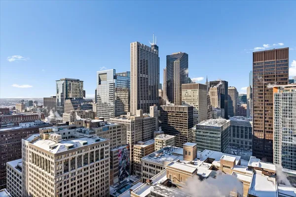 a view of city with tall buildings