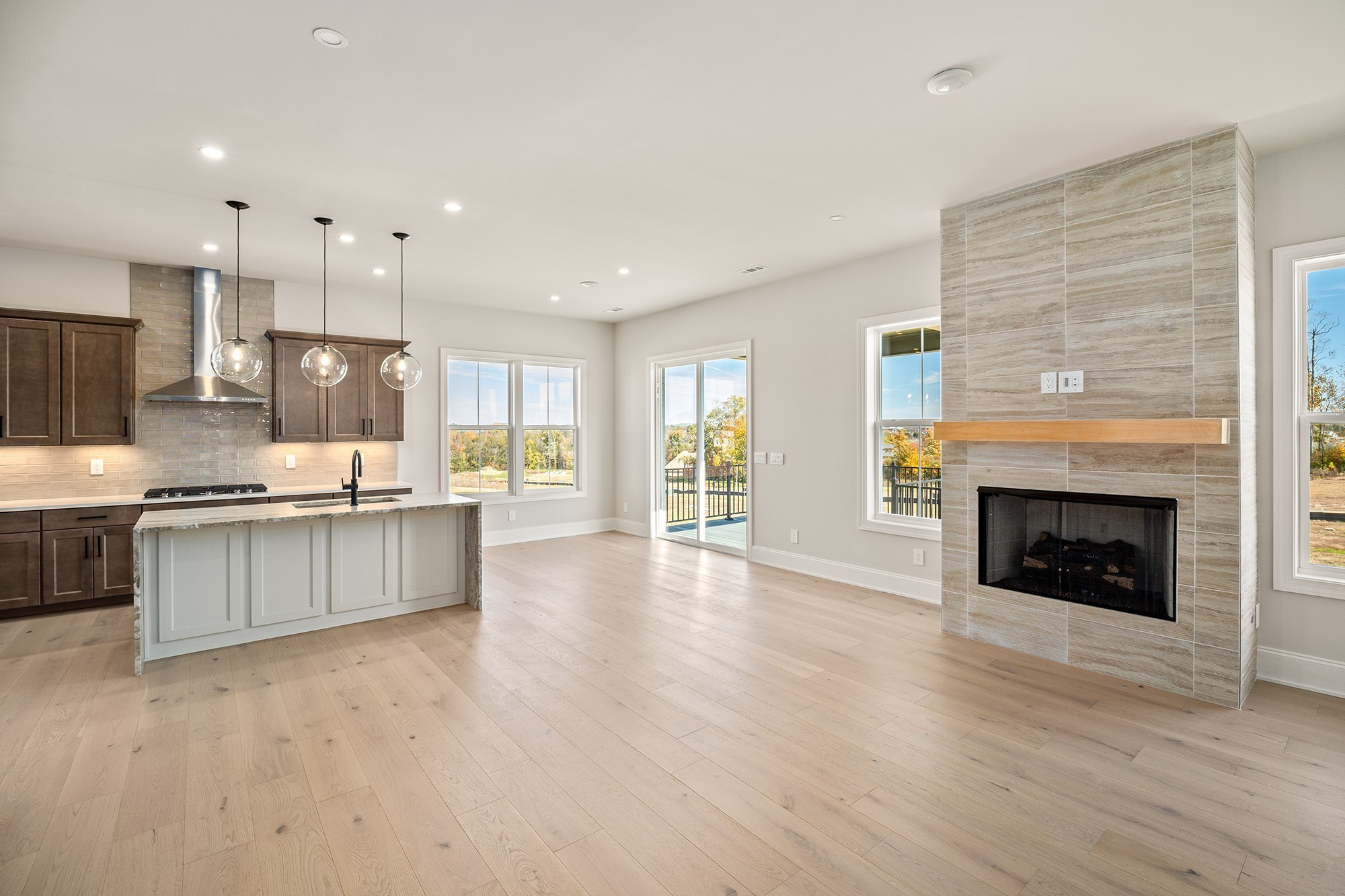 1420 Round Hill Lane Spring Hill, TN 37174 - Photo 12 of 29 a large kitchen with a stove top oven a sink a counter space and cabinets