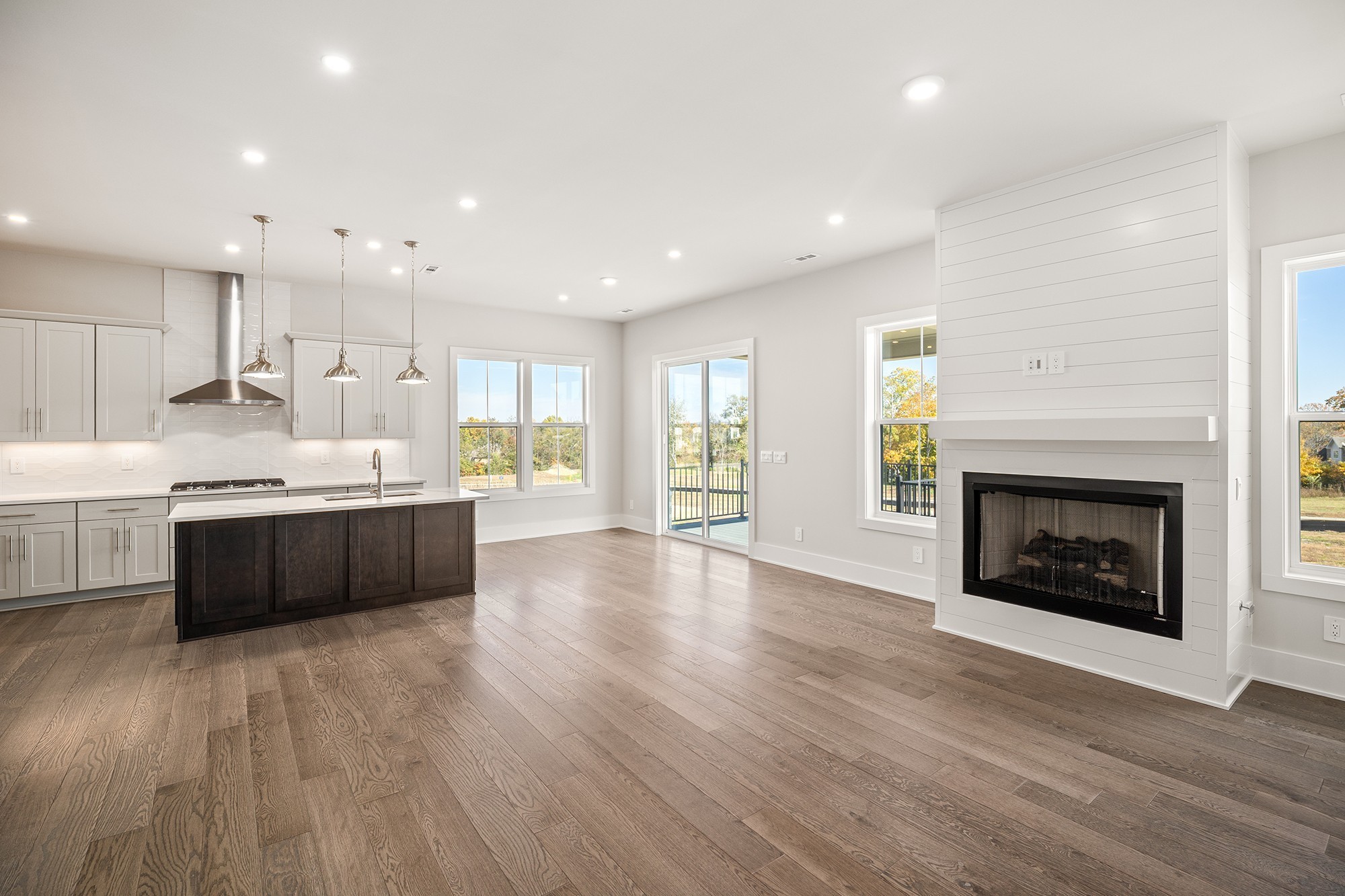 1420 Round Hill Lane Spring Hill, TN 37174 - Photo 14 of 29 a large kitchen with a large counter top and a fireplace