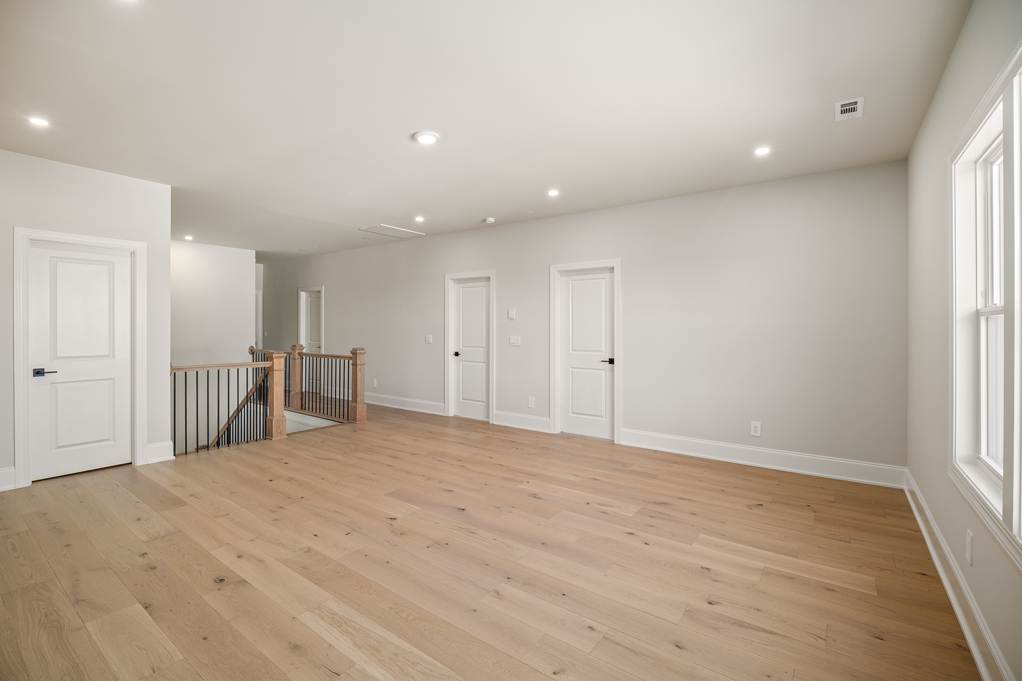 1420 Round Hill Lane Spring Hill, TN 37174 - Photo 20 of 29 a view of an empty room with wooden floor