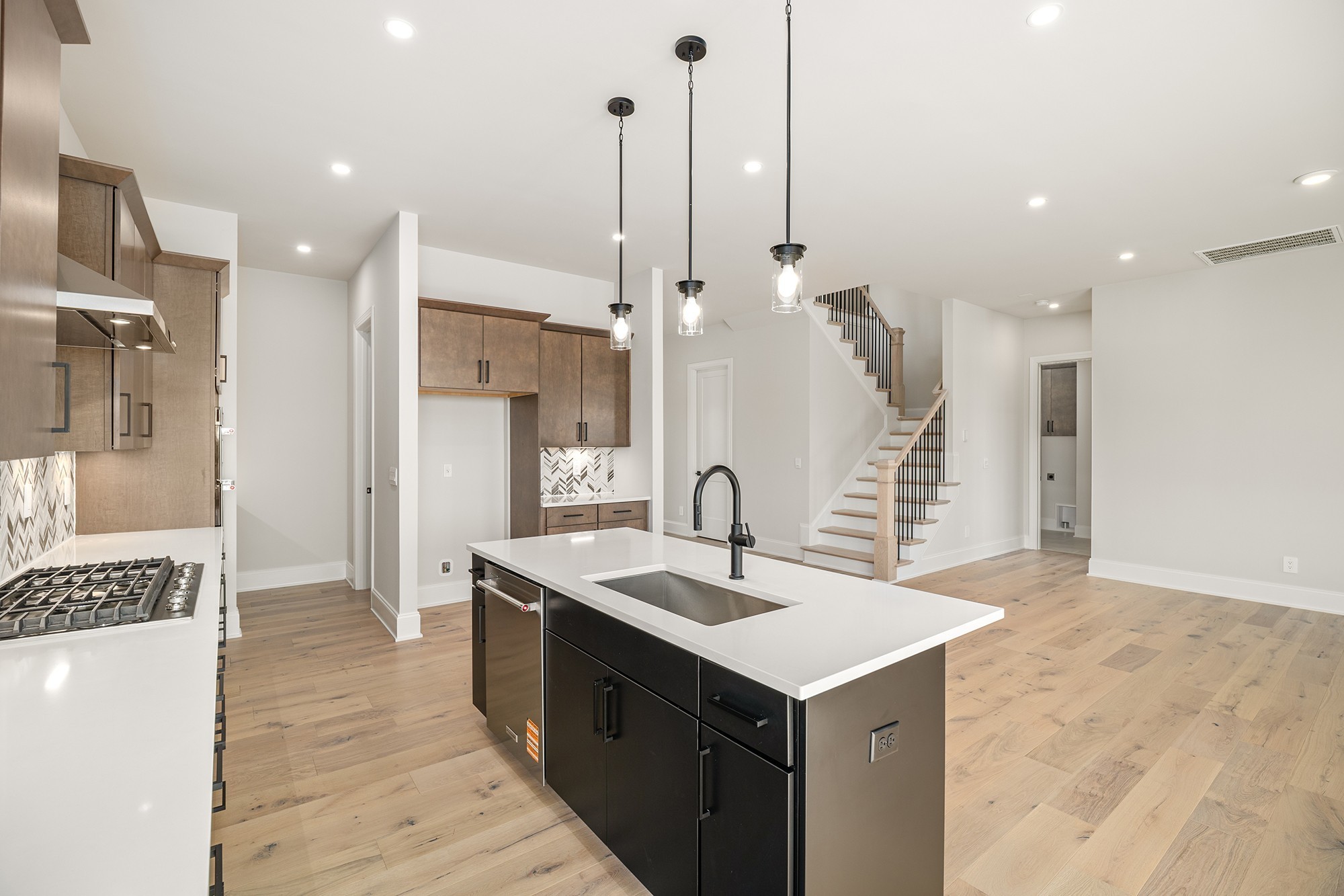 1420 Round Hill Lane Spring Hill, TN 37174 - Photo 25 of 29 a kitchen with a sink a refrigerator and a stove