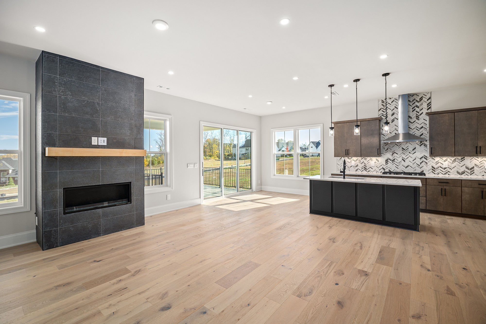 1420 Round Hill Lane Spring Hill, TN 37174 - Photo 7 of 29 a large kitchen with a stove and a wooden floors