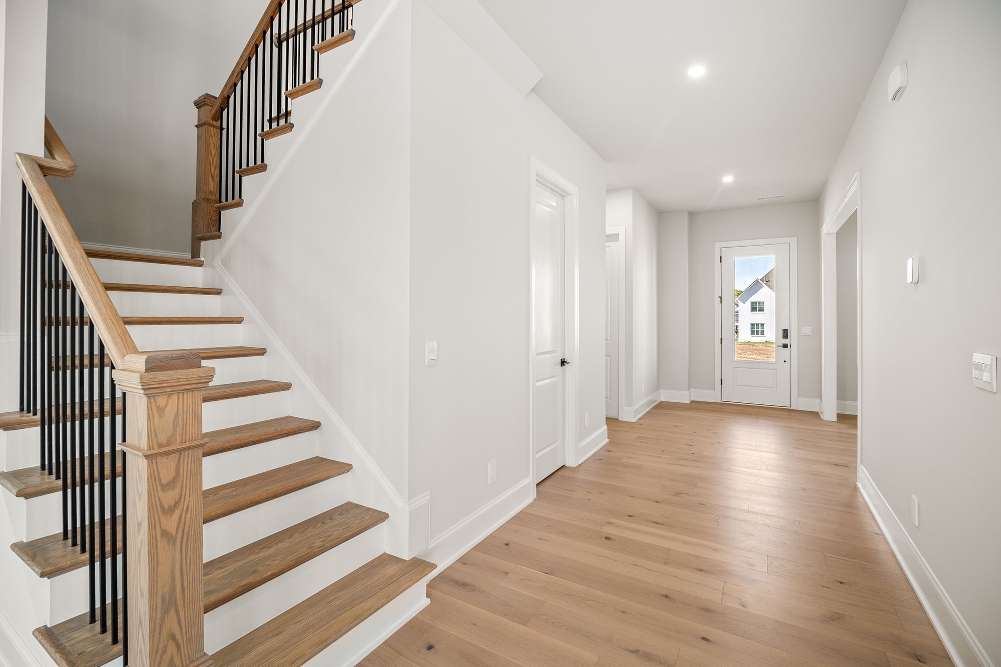 1420 Round Hill Lane Spring Hill, TN 37174 - Photo 8 of 29 a view of an entryway with wooden floor and stairs