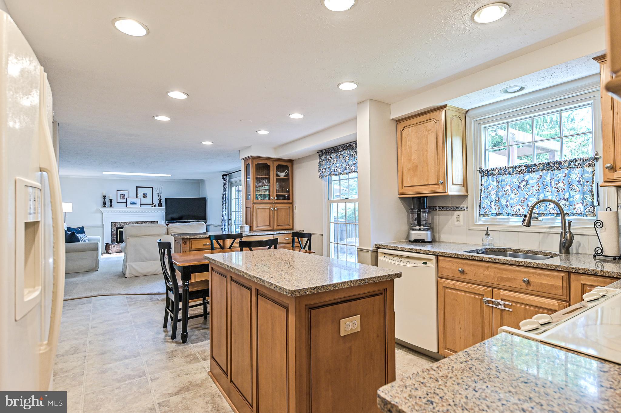 7553 Cloud Court Springfield, VA 22153 - Photo 9 of 32 Kitchen with quartz, tile back splash, & island