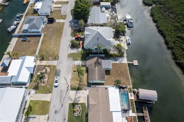 an aerial view of a house with a ocean view