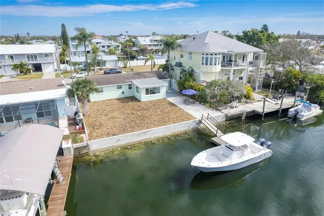 an aerial view of a city with ocean view