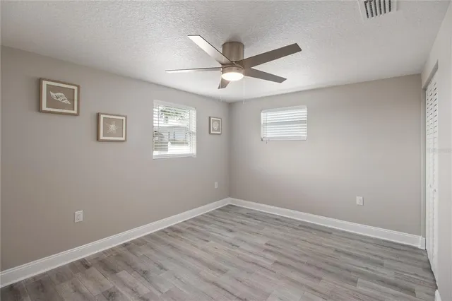 a bathroom with a sink toilet a mirror a bathtub and shower