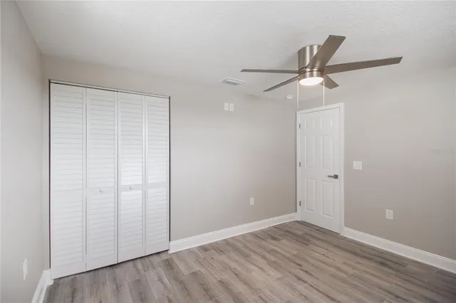 a kitchen with a sink a window and cabinets