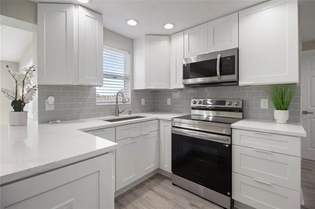 a kitchen with a sink and a window