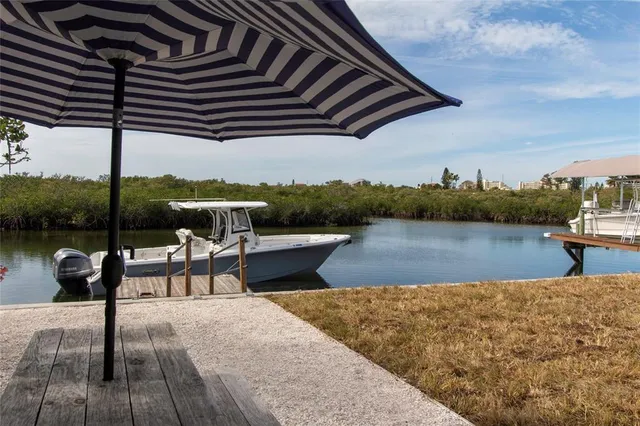 a view of a lake with sitting area