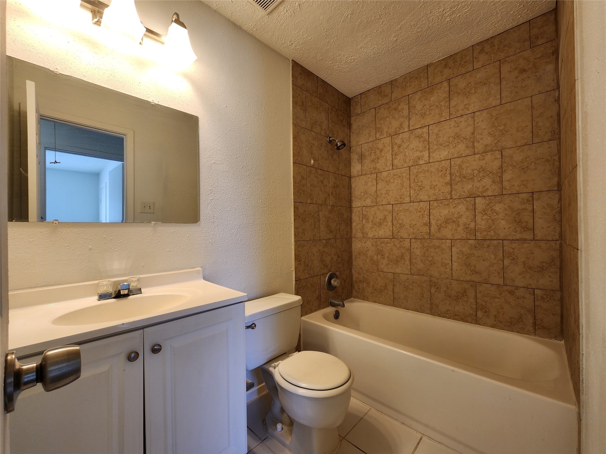 2446 Autumn Springs Lane Spring, TX 77373 - Photo 11 of 13 a bathroom with a sink mirror toilet and bathtub