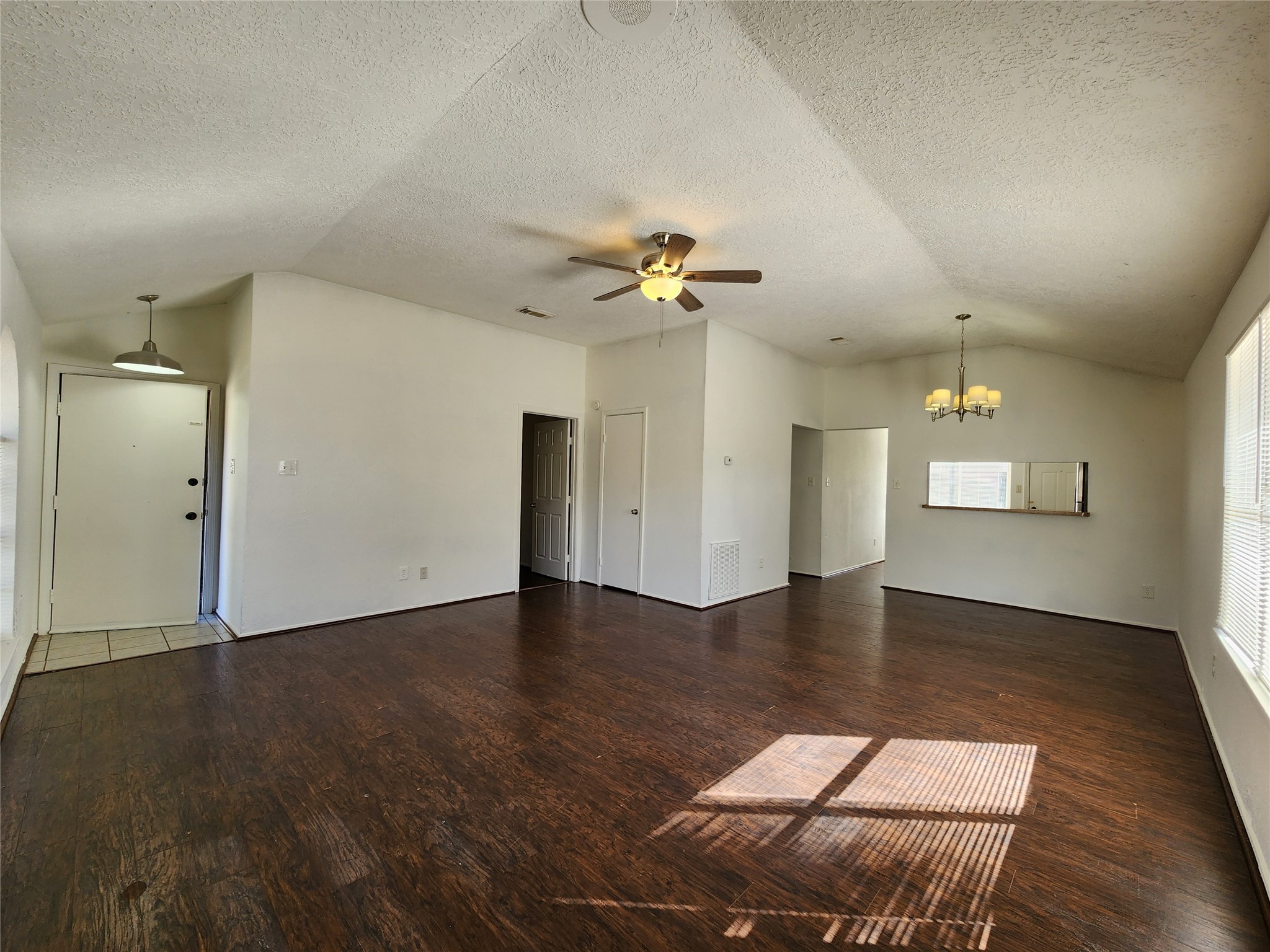 2446 Autumn Springs Lane Spring, TX 77373 - Photo 3 of 13 an empty room with wooden floor and ceiling fan