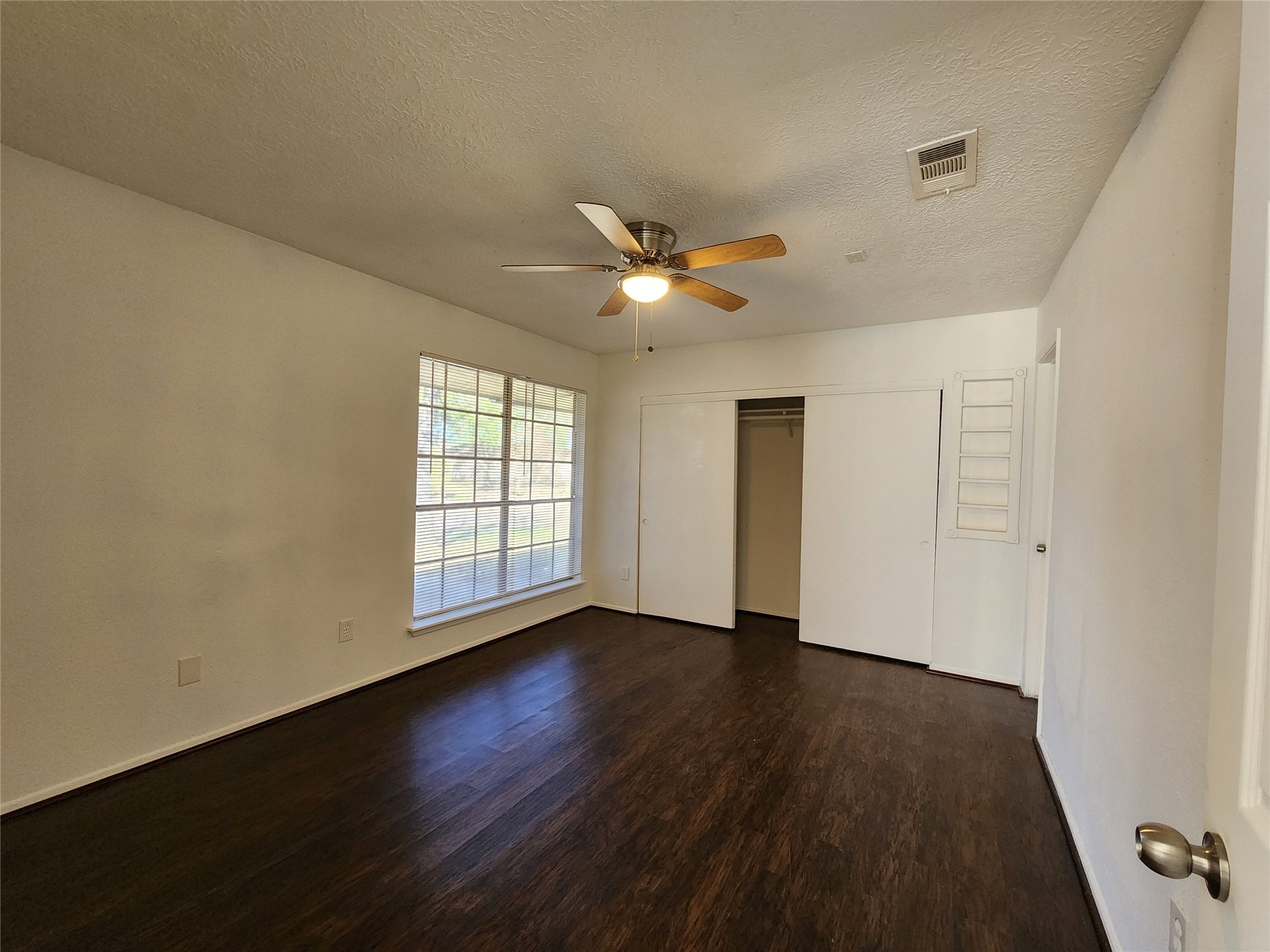 2446 Autumn Springs Lane Spring, TX 77373 - Photo 4 of 13 an empty room with wooden floor and windows