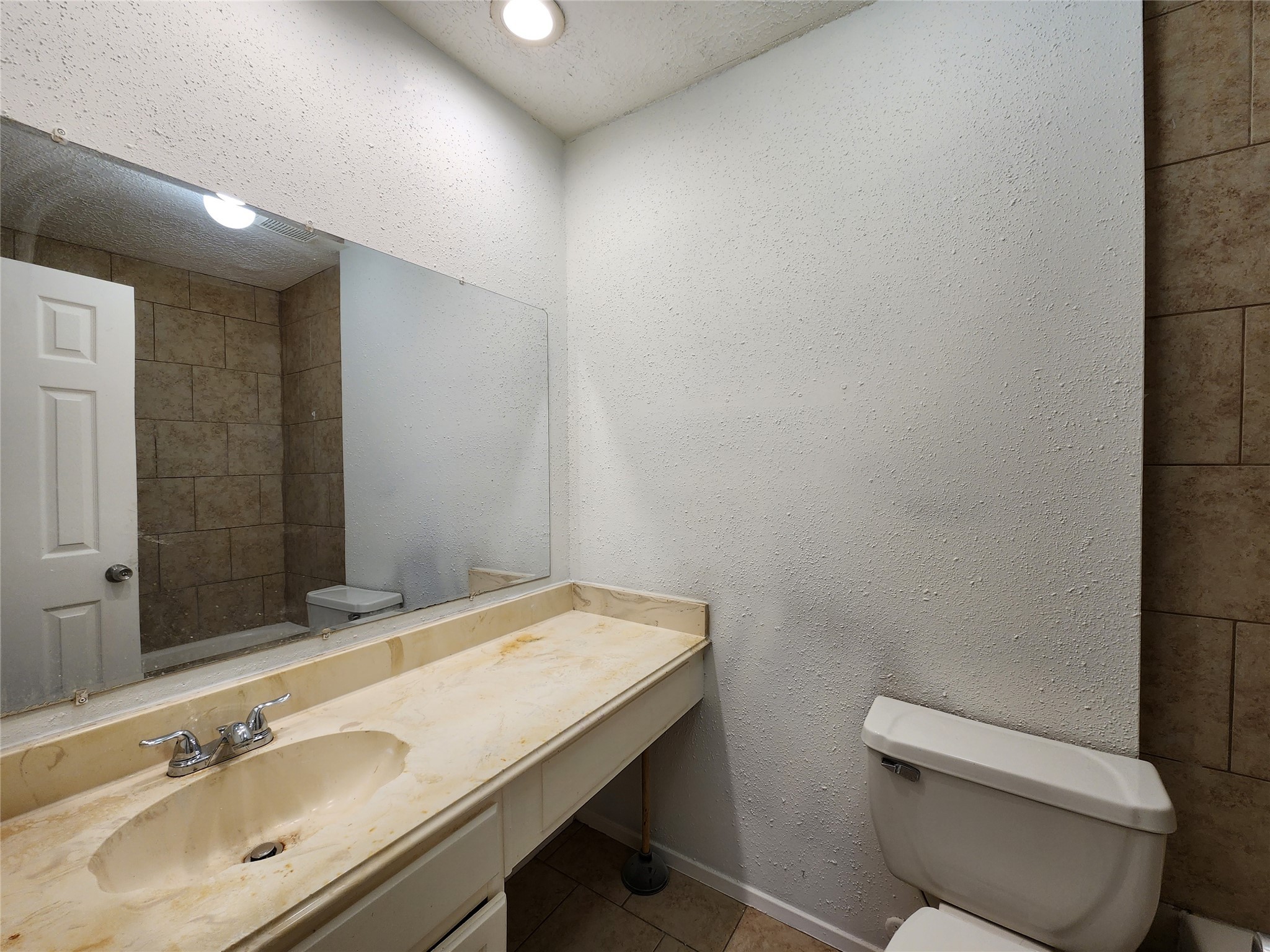2446 Autumn Springs Lane Spring, TX 77373 - Photo 5 of 13 a bathroom with a toilet sink and mirror