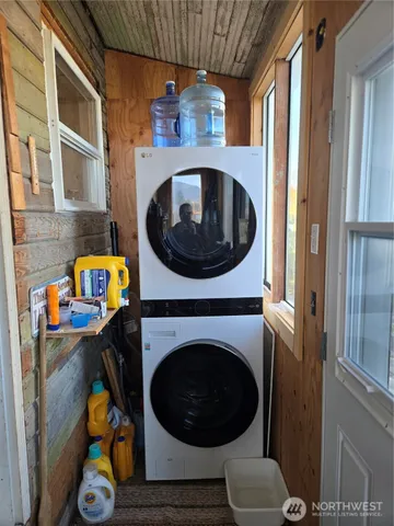 a kitchen with a white cabinets and white appliances